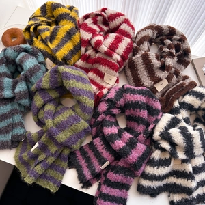 Colorful striped wool knit scarves displayed in various vibrant color combinations
