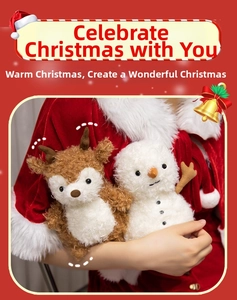 Detailed close-up of plush Christmas reindeer and snowman dolls in holiday gift packaging