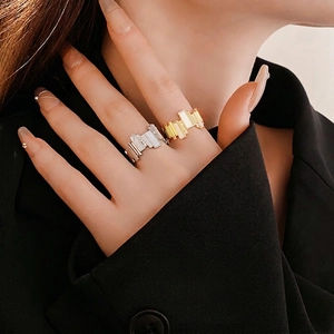 Irregular geometric gold and silver rings with cubic zirconia for an elegant fashion style