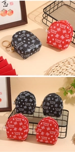 Detailed view of mini backpack coin purses in red and black with Good Luck tiger prints