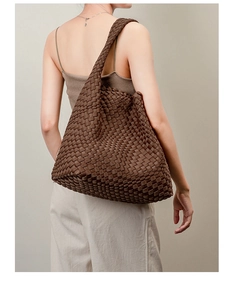 Detail view of brown woven neoprene tote bag showing texture and handmade craftsmanship