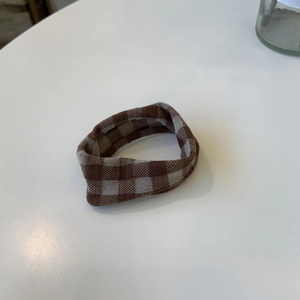 Maillard brown checkered scrunchie with knit texture for elegant hair styling