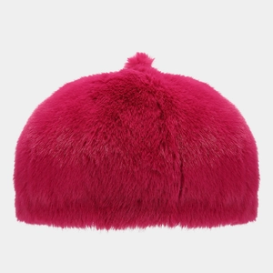 Close-up of vibrant hot pink plush beret made of fluffy faux fur for winter warmth