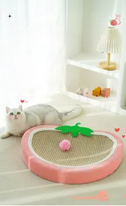 Detail of strawberry sisal cat scratcher bed with plush pink trim and toy ball