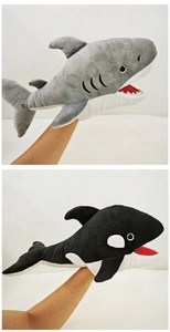 Detailed view of plush shark and orca hand puppets for interactive parent-child play