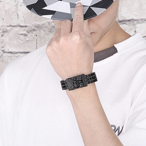 Men's hip hop skull bracelet featuring a chunky black chain worn in a street style look