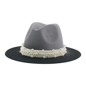 Detail of grey and black felt fedora featuring elegant white pearl bead decorations