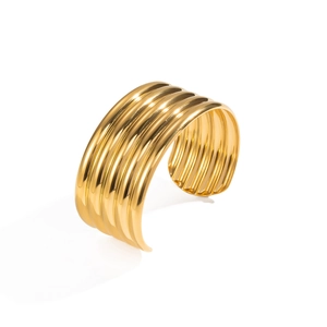 Macro shot of 18K gold plated wide ribbed cuff bracelet with polished wavy stripe details
