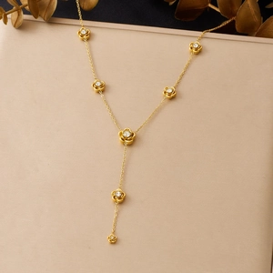 Elegant gold Y-shaped necklace featuring delicate rose pendants with cubic zirconia accents