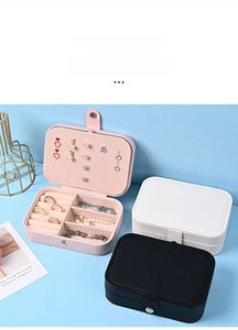 Close-up of portable PU leather jewelry box set showing rings and earrings storage slots