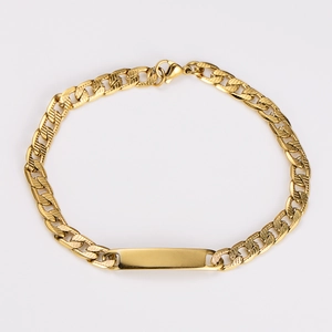 Detail of 7mm gold cuban link bracelet with blank metal plate and lobster clasp