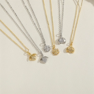 Elegant ladybug, bee, and flower pendant necklace set with sparkling zircon in gold and silver