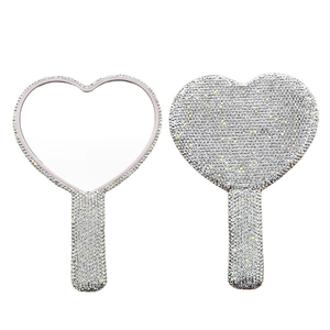 Sparkling silver rhinestone heart-shaped handheld mirrors showing front and back view