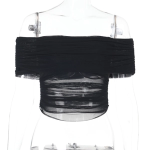 Detail of sheer black mesh off-shoulder top with intricate ruching and slim fit design