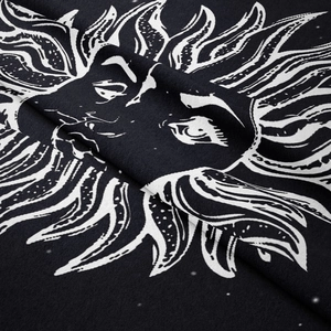Close-up of soft bohemian sun tapestry showing fabric texture and black white printing