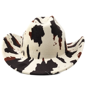 Detailed view of western cow print felt cowboy hat with classic brim and pattern