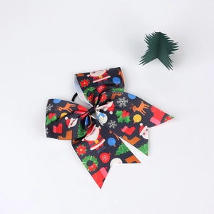 Christmas bow hair tie featuring Santa and reindeer prints with green 3D tree prop