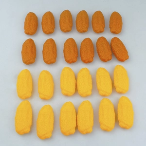 Macro detail of realistic food-shaped pens with textured orange and yellow surfaces