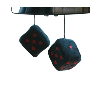 Plush heart car dice pendants in soft navy blue fabric hanging from a rear view mirror