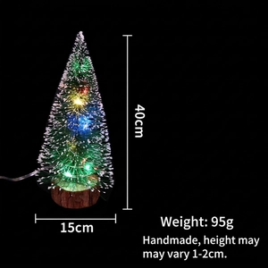 Detail of 40cm mini Christmas tree with LED lights and white snow tips on wood base