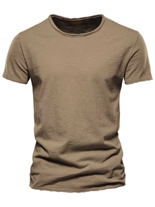 Close-up of khaki slub cotton fabric texture on a classic crewneck short sleeve T-shirt