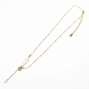 Golden baroque pearl necklace with an engraved heart pendant on a clean white background