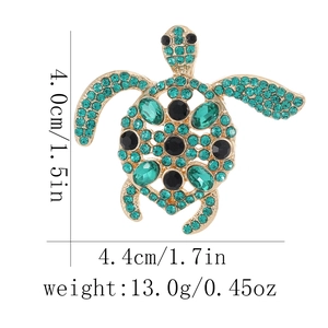 Detailed view of turtle brooch with rhinestones showing dimensions 4.4cm and weight 13.0g