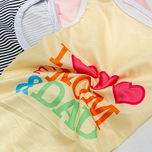 Soft yellow dog vest with 'I LOVE MOM & DAD' print and breathable cotton fabric