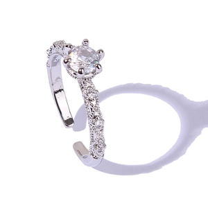Elegant silver open ring with central round diamond and side pavé zircon accents