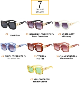 Seven colorful oversized square sunglasses with gold metal hinges in various frame colors