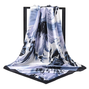 Elegant floral square silk scarf in blue and purple with a black border detail