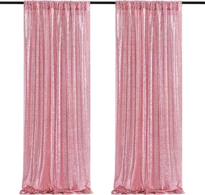 Close-up of pink sequin curtains on a black rod, sparkling fabric detail for events
