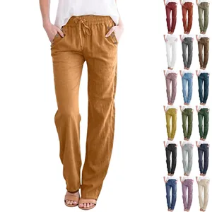 Detail of drawstring waistband and texture of breathable linen casual trousers
