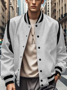 Detail of color-block baseball jacket with grey body, black sleeves and metal snap buttons