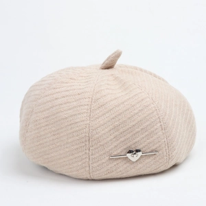 Elegant beige herringbone beret for women with a silver heart-shaped metal buckle detail