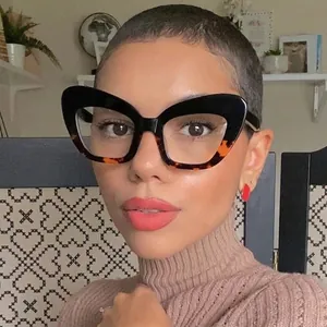 Chic cat-eye anti-blue light glasses with tortoise frame worn by a model in a home setting