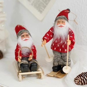 Santa Claus doll figurines on wooden sleds and skis in classic Nordic holiday style