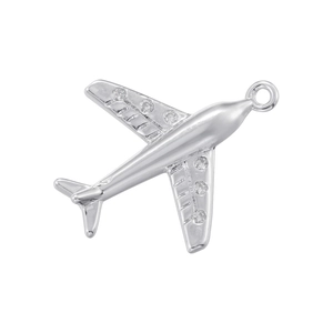 Detailed view of silver airplane charm with sparkling stones and polished metal finish
