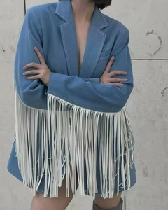 Detailed view of long white fringe decoration on blue wool blend blazer with suit collar