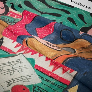 Close-up of bohemian art print fabric showing detailed texture and satin luster finish