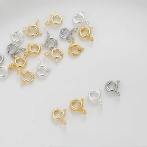 Close-up of gold and silver spring ring clasps for DIY jewelry necklace making
