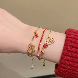 Three-piece red string bracelet set with golden horse and heart crystal pendants