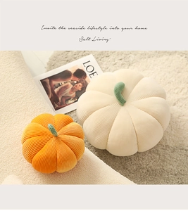 Detail of ribbed corduroy texture on orange and cream pumpkin decorative pillows