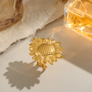 Detail shot of vintage golden sunflower open ring with realistic petal texture
