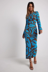 Close-up of knit texture on blue and brown leopard print long sleeve maxi dress