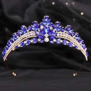 Exquisite gold wedding crown featuring teardrop blue rhinestones and sparkling crystals