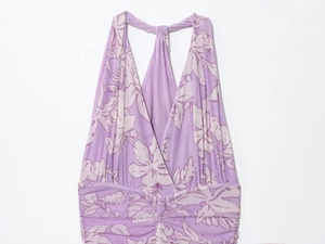 Detail of purple floral mesh maxi dress showing halter V-neckline and ruched waist