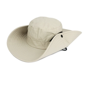 Macro detail of breathable beige quick-dry fabric and side snap button on the sun hat