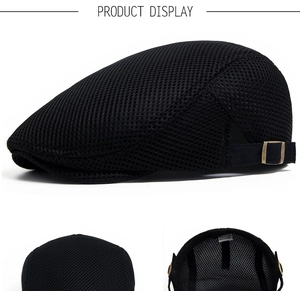 Detail view of breathable black mesh beret showing adjustable metal buckle and inner lining