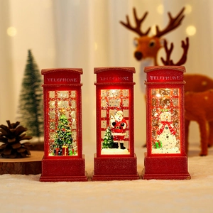 Farolillos rojos de cabina telefónica navideña con Papá Noel, muñeco de nieve y efecto nieve